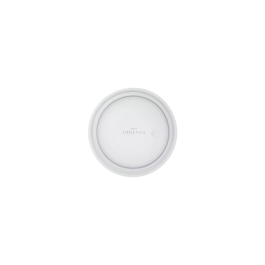 Round white object with 'Kiehl's' branding on a white background