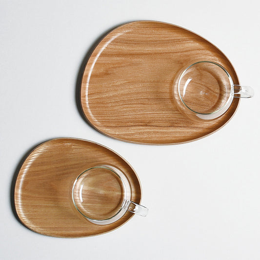 Two wooden trays with glass cups on a light gray background