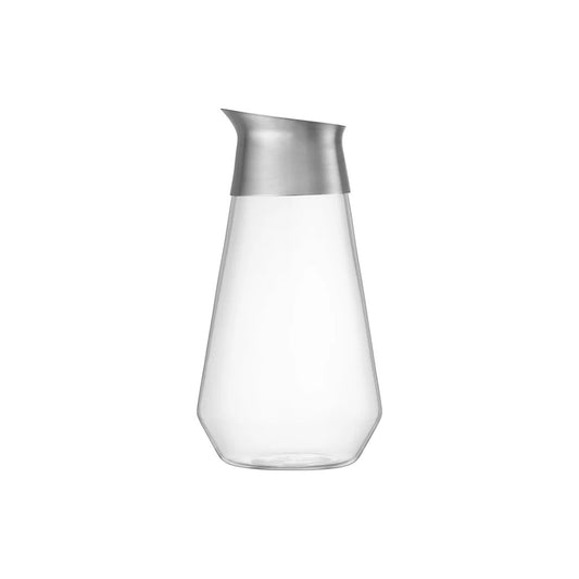 Clear glass carafe with silver lid on a white background